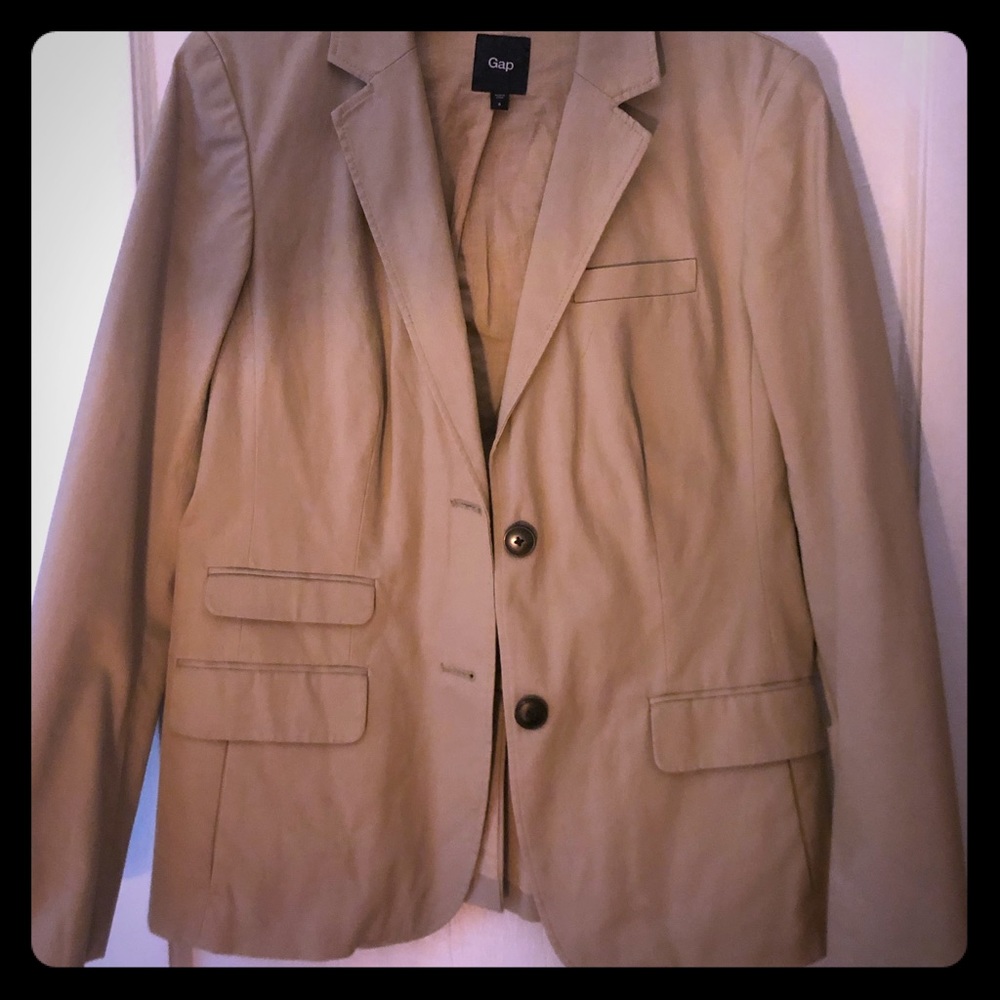 Tan blazer with yellow accent inside